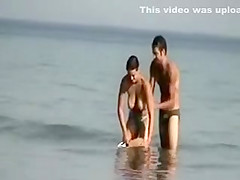 Dude playing around with a topless girl