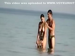 Dude playing around with a topless girl