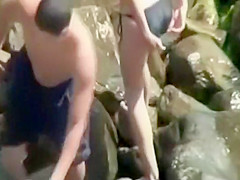 Sneaking to a couple fucking on the rocks