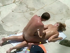 Oil rub leads to hot beach sex