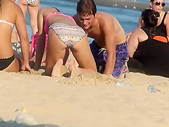 She plays with his cock and sucks it