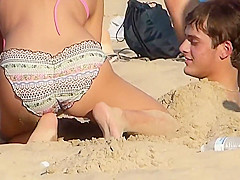 She plays with his cock and sucks it