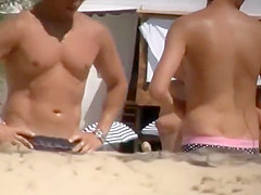 A very hairy pussy on a nudist beach