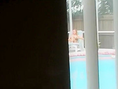 She reads a book and swims naked