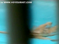 She reads a book and swims naked