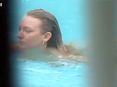 She reads a book and swims naked