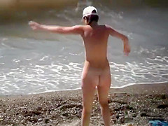 Naturists enjoying the wavy sea