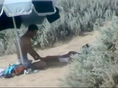 Couple making out on the beach