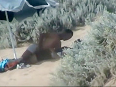 Couple making out on the beach