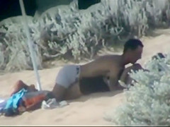 Couple making out on the beach