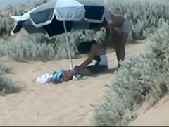 Couple making out on the beach