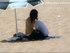 Couple making out on the beach
