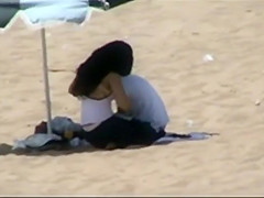 Couple making out on the beach