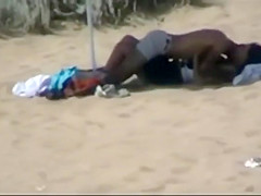 Couple making out on the beach