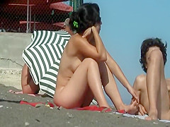 Hairy butt crack of a naked beach girl