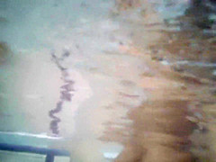 Underwater voyeur in swimming pool