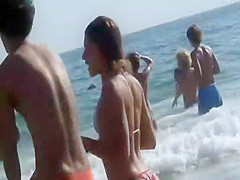 Irresistible asses of two girls at a beach