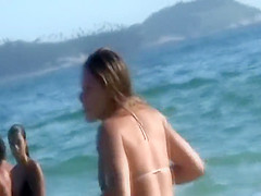 Irresistible asses of two girls at a beach