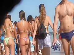 Irresistible asses of two girls at a beach