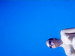 Naked girl plays in the shallow water