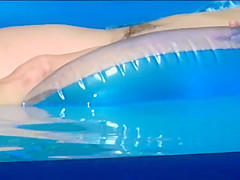 Peeping her naked floating at her pool