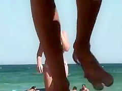 Gigantic natural boobs spied on a beach