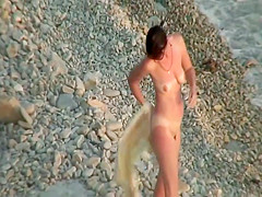 Sunburned woman is naked on a beach