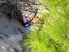 Aroused girl rubbing her pussy on a beach