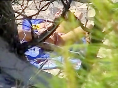 Aroused girl rubbing her pussy on a beach