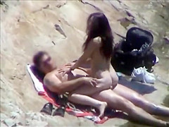 She rides his dick on a beach