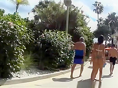 Two chicks with nice asses walking