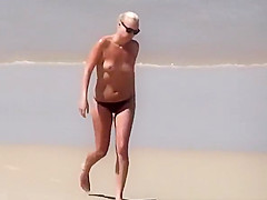 Blonde woman topless with small boobs