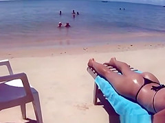 Hot woman in small bikini at the beach