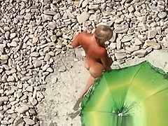 Chubby blonde nudist with her man