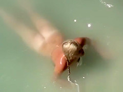 Chubby blonde nudist with her man