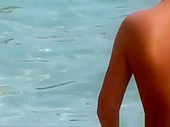 Topless woman in see