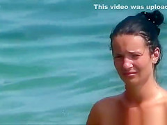 Topless woman in see