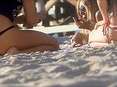 Stunning beach girl bends over