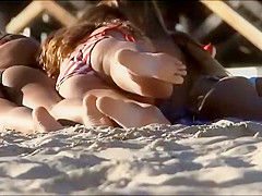 Stunning beach girl bends over