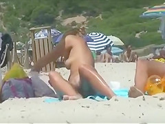 Smooth skin of a nude girl at a beach