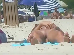 Smooth skin of a nude girl at a beach