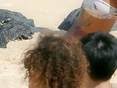 Sexy and tattooed asian beach babe