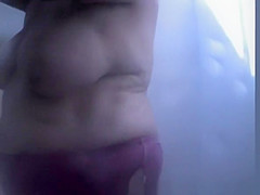 Chubby mature woman caught in beach cabin