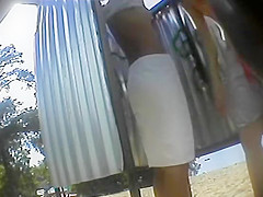 Teenage girl puts a skirt on