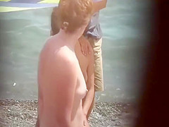 Sexy woman getting a beach massage