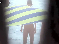 Sexy woman getting a beach massage