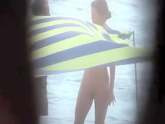 Sexy woman getting a beach massage