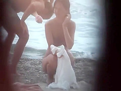 Sexy woman getting a beach massage