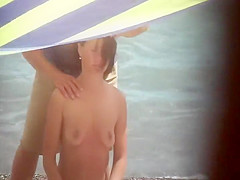 Sexy woman getting a beach massage