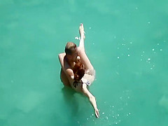 He teaches her how to swim
